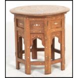 A believed early 20th century Moorish hardwood inlaid Binares traders table of octagonal form with