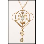 An early 20th century 9ct gold Edwardian seed pearl and aquamarine necklace and pendant. The pendant