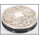 A vintage silver embossed double panel hand mirror having decoration of flowers and leaves. Silver