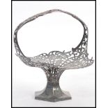 A stunning silver plated early 20th Century centre piece / flower basket, floral fret work design