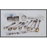 A selection of silver and silver plated items to include a Birmingham hallmarked round napkin