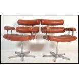 A pair of retro 20th century salon / barbers. Having a red button back vinyl upholstery, reclining