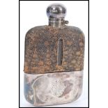 A silver hallmarked and snake skin gentleman's hip flask.