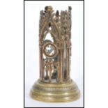 A 19th century Victorian brass pugin Gothic ecclesiastical night light of tall pierced cylindrical