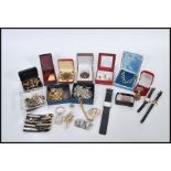 A collection of vintage retro costume jewellery, consisting of watches, necklaces, brooches, tie