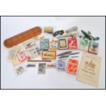 A collection of vintage items to include vintage playing cards, Diecast play worn vehicles,