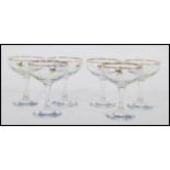 A set of six vintage retro 20th century Babycham advertising glasses raised on circular bases with