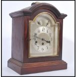 A 20th century Junghans bracket clock with westminster chime action having silvered dial with