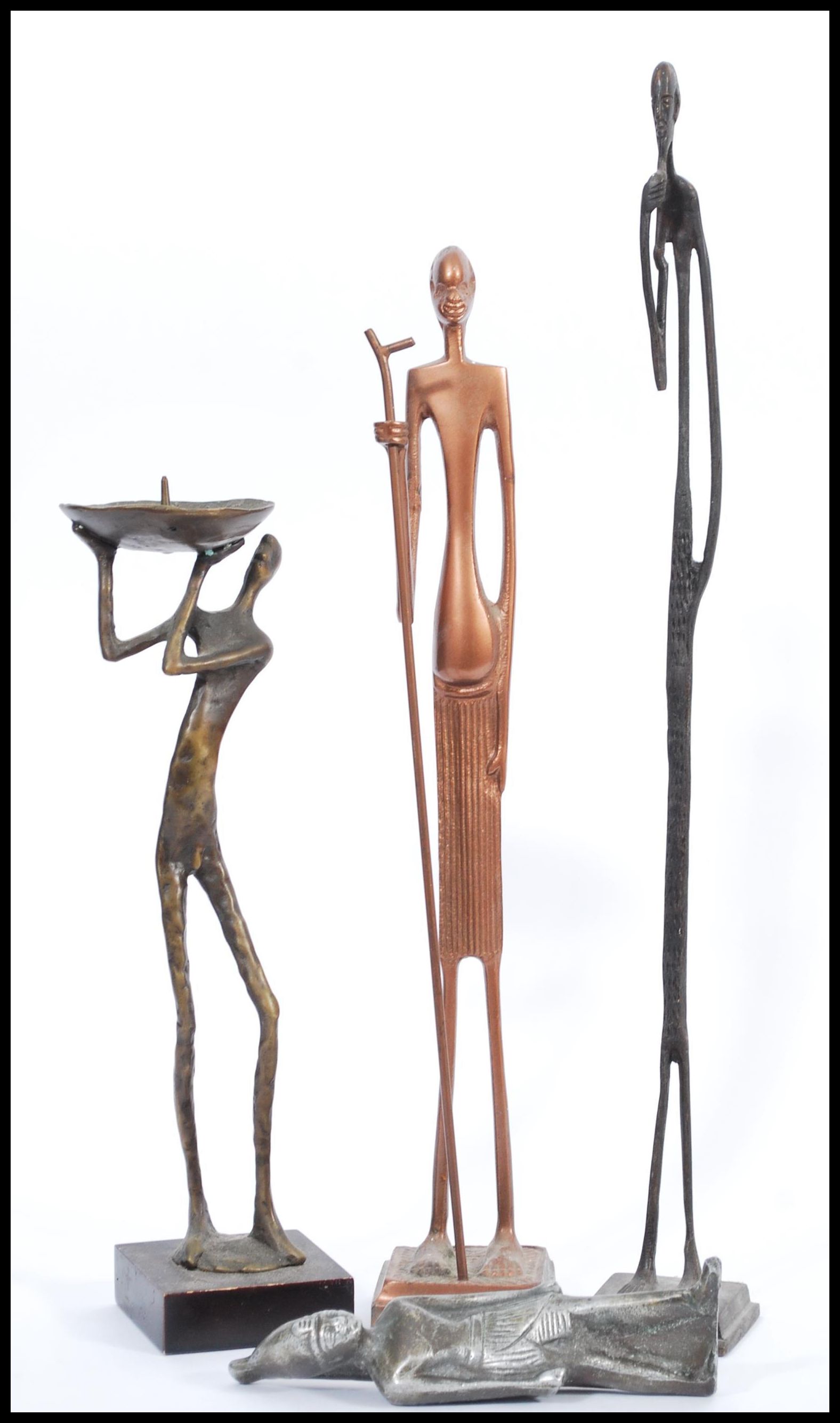 A group of three vintage 20th century bronze African figures / statues to include a candlestick