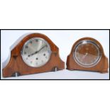Two vintage early 20th century mantel clocks to include an oak cased eight day Smiths example and