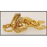 A gold plated pendant necklace having a pendant seal in the form of a lion with a spring ring clasp.