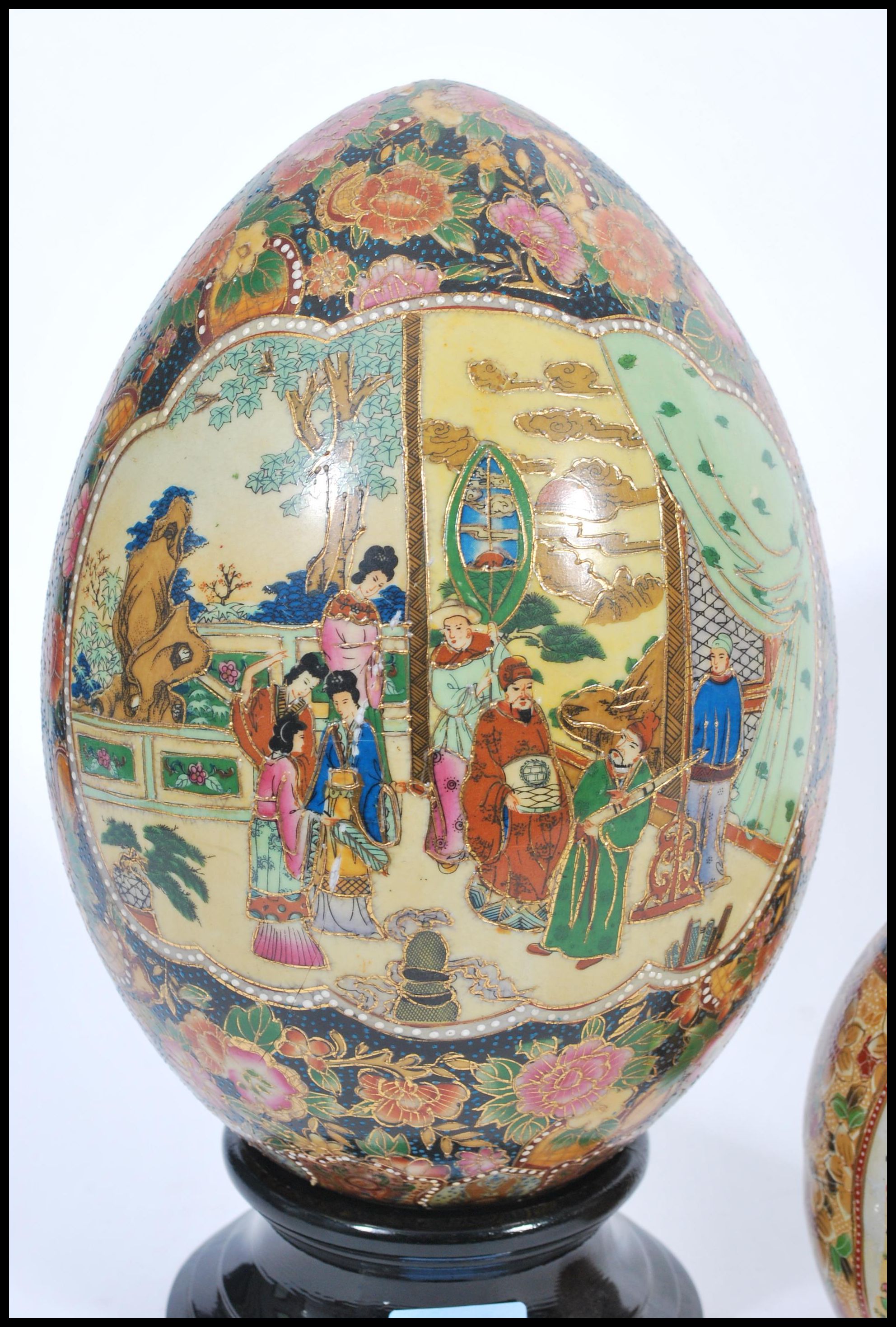 A group of three vintage 20th century Japanese ceramic eggs to include a large example on ebonised - Image 2 of 6