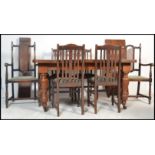 A 19th century Victorian large oak extendable winder dining table raised on turned supports with two