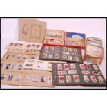 A large collection of vintage cigarette cards in albums and sets dating from the early to mid 20th