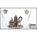 A group of good quality silver plate to include a pair of silver plated and cut glass claret jug,