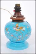 A Victorian blue glass and hand painted lamp. Of bulbous form with vivid blue glass being