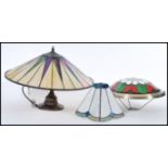 A group of vintage Tiffany style stained glass lamps and shades to include on lamp with leaded glass