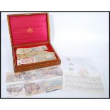 A collection of vintage banknotes contained within a Mappin and Webb cutlery box. Comprises of White
