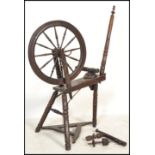 A believed 19th century Victoria North County Spinning Wheel having turned legs bobbin style base