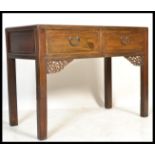 A 20th Century Chinese elm alter / side table, two drawers to the front with fitted drop handles