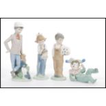 A group of four Lladro type Nao figurines to include reclined clown child, boy with ball, boy at