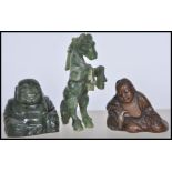 A group of three Chinese figures to include a jade figurine of a horse in rearing position, a carved