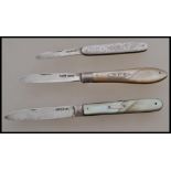 A group of three silver hallmarked and mother of pearl handled fruit pen knives. One hallmarked