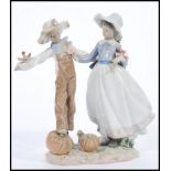 A Lladro porcelain figurine of a lady and scarecrow. Model 5835. Printed marks to base. 27cm high.