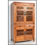 An early 20th century Chinese tall pedestal twin section marriage cabinet. Each section with lattice