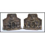 A pair of early 20th century bronze bookends in the form of Abraham Lincoln seated on bench. Made in