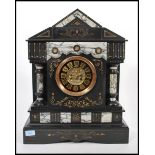 A 19th Century French slate mantel clock in the style of Japy Freres, in a black slate and limestone