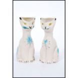 A pair of unusual retro 1960's Arthur Wood 'Smoky' ceramic vases in the form of cats with hand