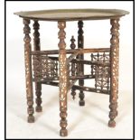 An early 20th century Colonial period Raj Anglo-Indian Benares table having a mother of pearl inlaid