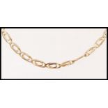 A 9ct gold decorative flat linked chain necklace with a lobster clasp. Weight 7.7g.