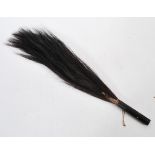 An early 20th Century African tribal zebra tail / horse hair fly swat / swish, the hardwood handle