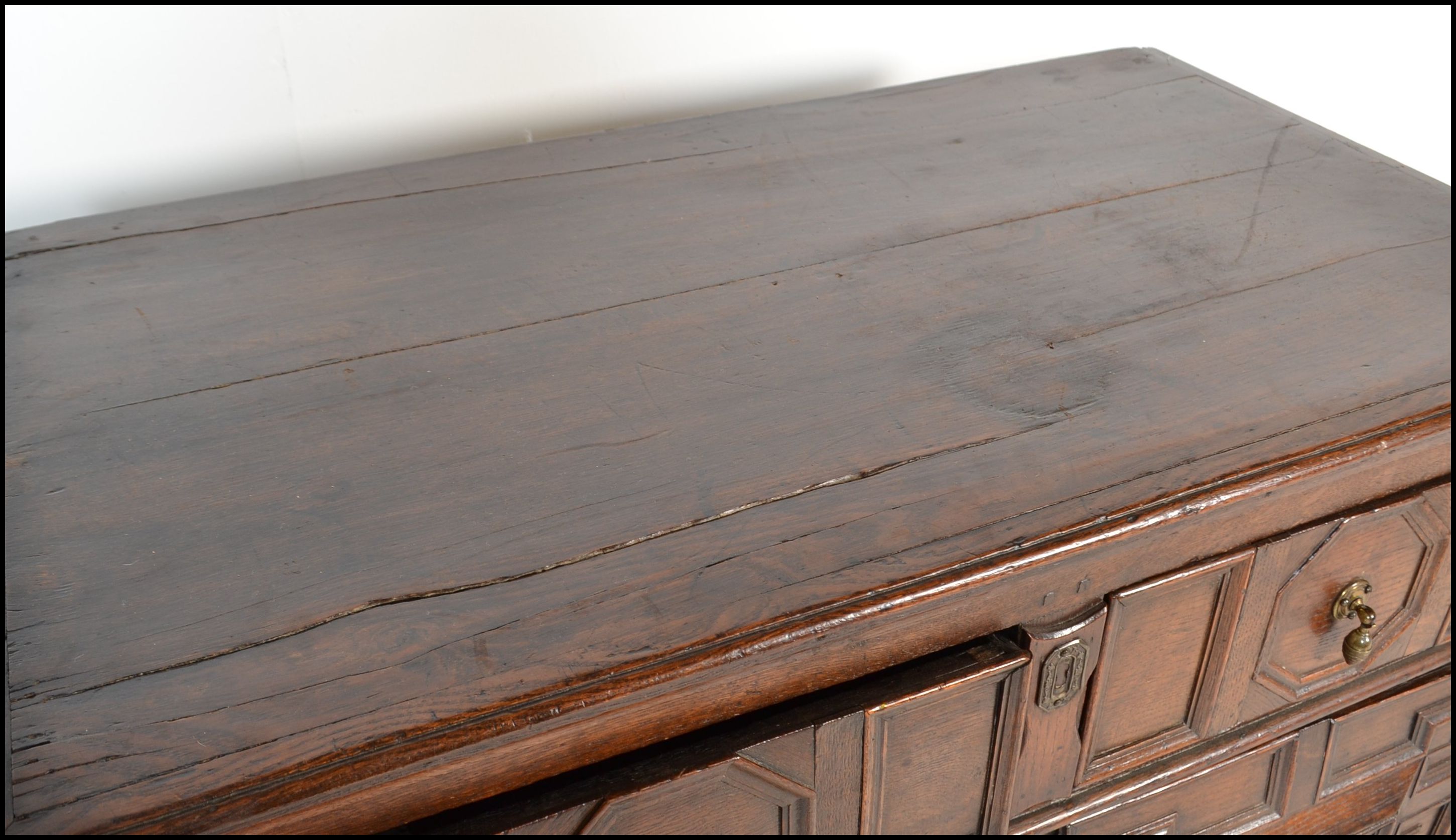 A 17th century Commonwealth oak block fronted chest of drawers. The bank of four drawers having - Image 4 of 16