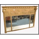 A 19th century giltwood and gesso work triptych overmantel mirror of large form. Each mirror panel