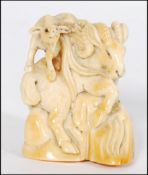 A good quality Japanese - Tokyo school Japanese Meiji period ivory carved okimono of aÿ Big Horn