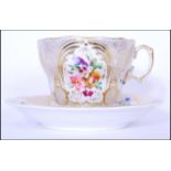 A Russian Imperial porcelain Gardner breakfast cup and saucer with hand painted floral sprays and