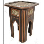 A 19th century Moorish mother of pearl inlaid hardwood square octagonal occasional table raised on a