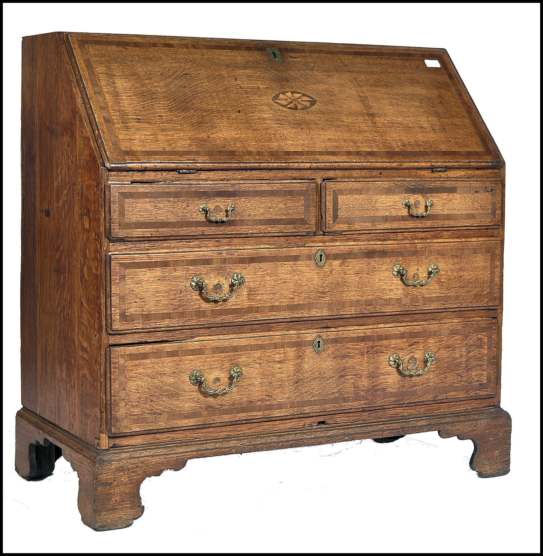 An 18th century North Country Lancashire bureau desk. Raised on bracket feet with a series of