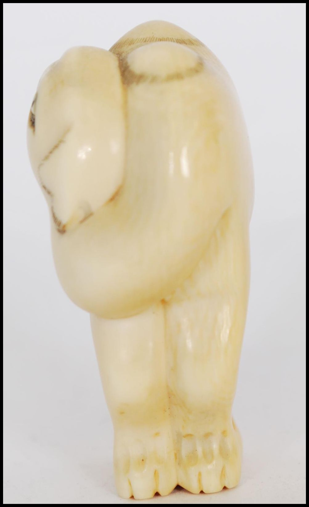 A rare Meiji period ivory Netsuke of a Bactrian camel. The head of the camel turned back standing on - Image 8 of 10