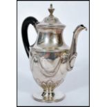 A late 18th / early 19th century silver hallmarked Georgian bachelors coffee pot raised on a