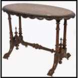 A 19th century High Victorian mahogany and marquetry inlaid ladies writing table desk. Raised on