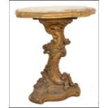 A 20th century Italian faux marble carved wooden centre / lamp table. The wooden base gilded and