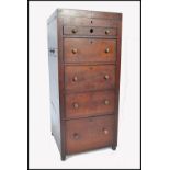 A 19th Century mahogany campaign wash stand / tall chest of drawers having lead lined drawers and