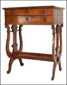 A 19th century continental walnut Biedermeier ladies vanity workbox table. Raised on lyre shaped