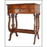 A 19th century continental walnut Biedermeier ladies vanity workbox table. Raised on lyre shaped