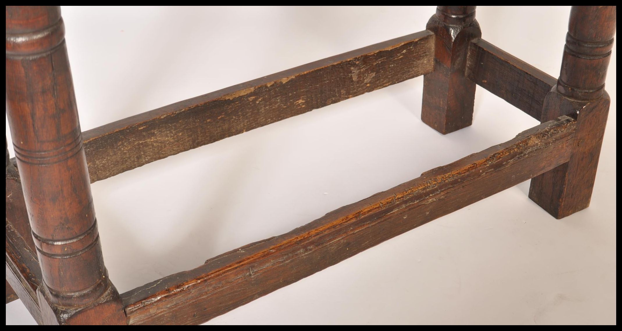 A 17th / 18th century country elm and oak joint stool. Unusual larger size with planked top over - Image 11 of 16