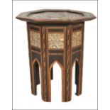 A 19th century Moorish mother of pearl inlaid hardwood octagonal occasional table raised on a shaped